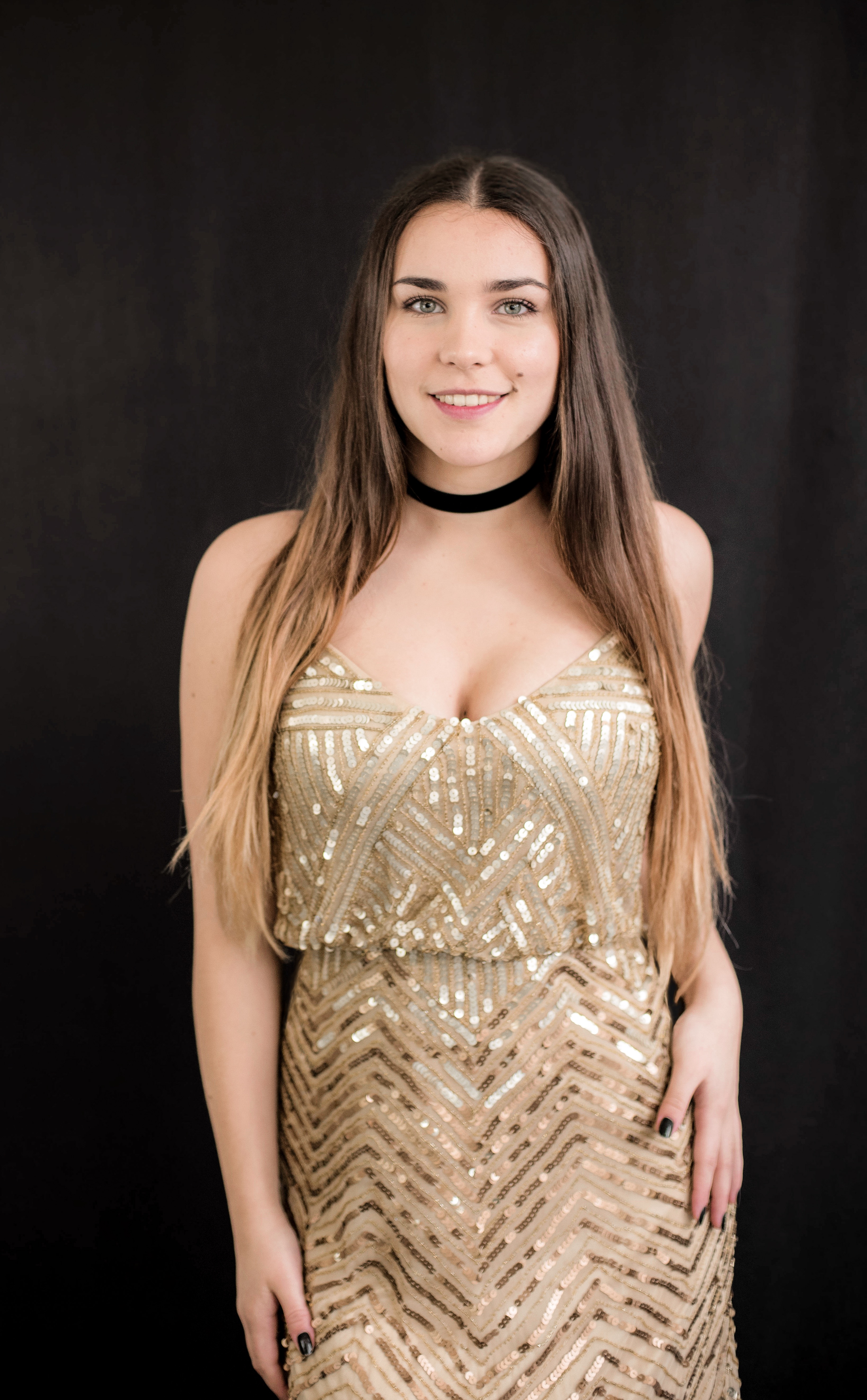 girl in a gold sequin dress
